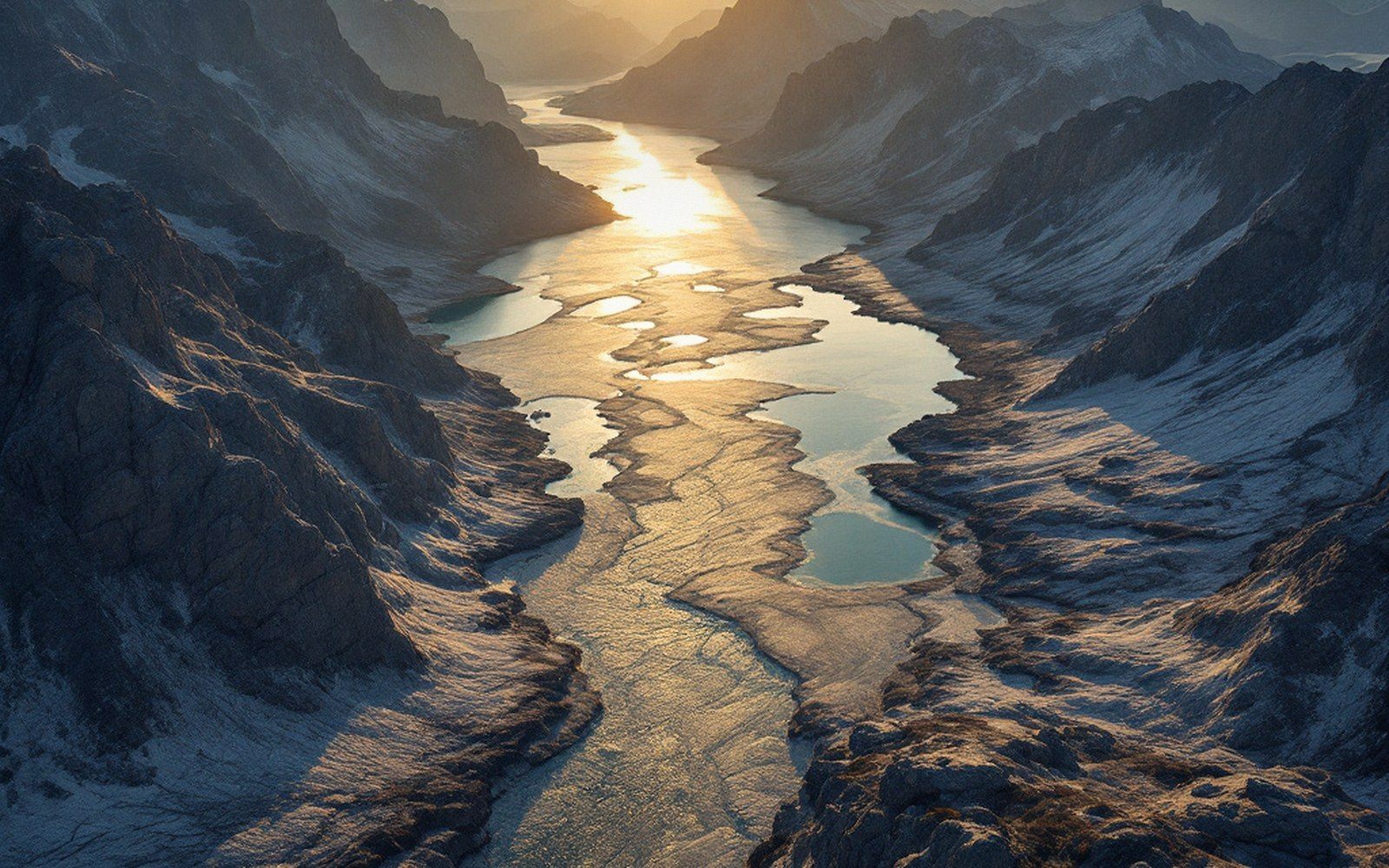 Bare glaciated granite with shallow lakes in the hollows, seen from the air, low sun